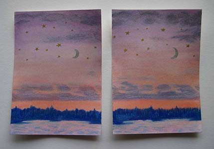 Two cards painted with near-identical scenes of a moon with stars against a sunset over water and trees.