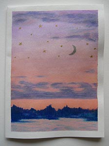One card painted with a scene of a moon and stars against a sunset over water and trees.